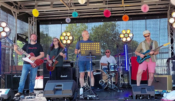 Portway Blues Band are Mark on vocals and harmonica, Andy on guitar, Tim on guitar, Paul on drums and Bonnie on bass